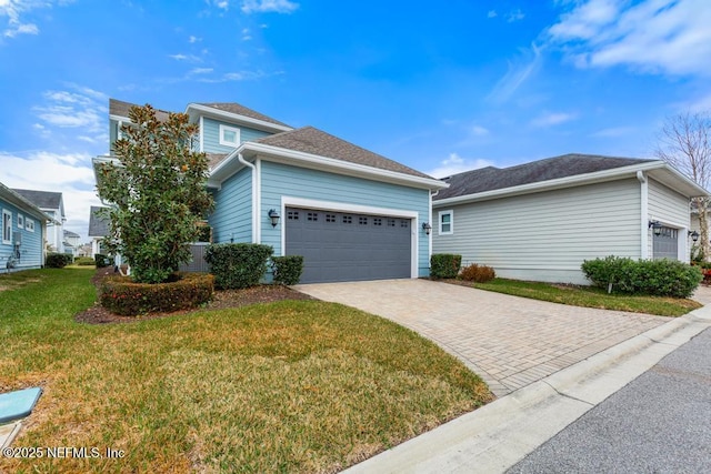 view of front of house featuring a garage and a front yard