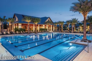 view of pool at dusk