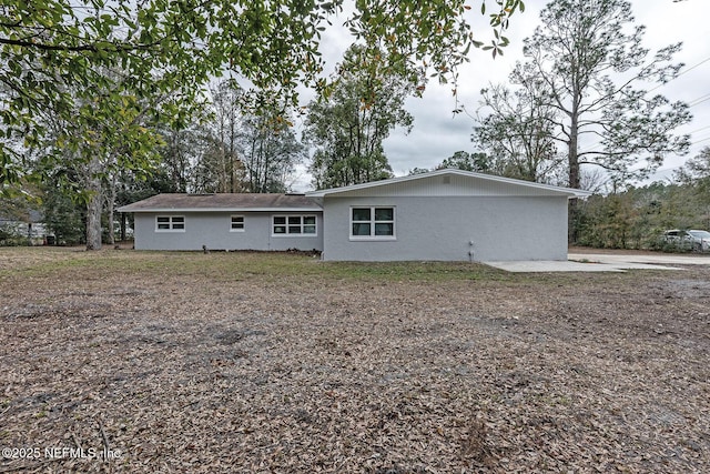 rear view of house featuring a patio