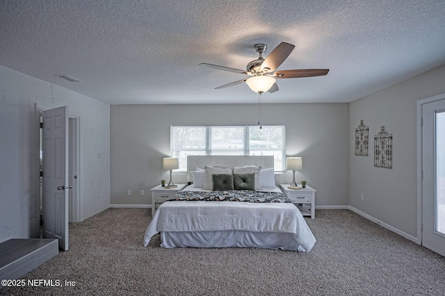 bedroom featuring a textured ceiling, carpet floors, and ceiling fan