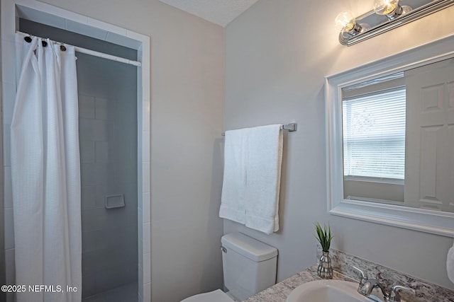 bathroom with vanity, toilet, and a shower with shower curtain