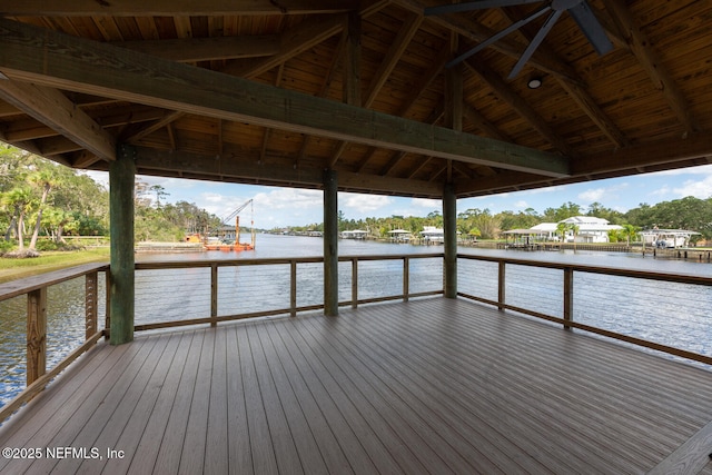 view of dock with a gazebo and a deck with water view