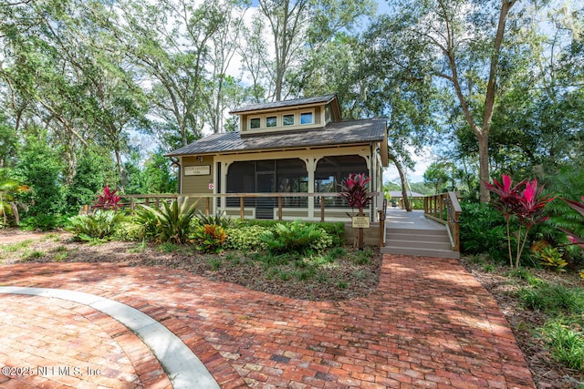 view of front facade featuring a sunroom