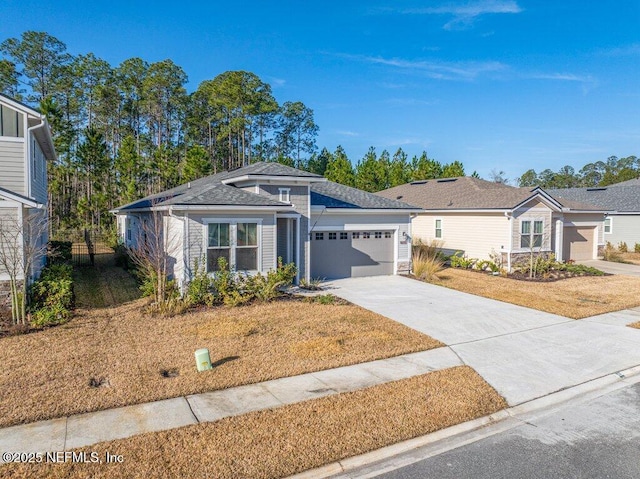 view of front facade featuring a garage and a front yard