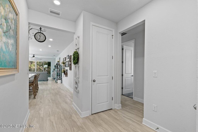 corridor featuring light hardwood / wood-style floors