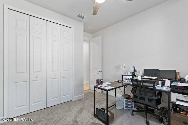 office with ceiling fan and light carpet