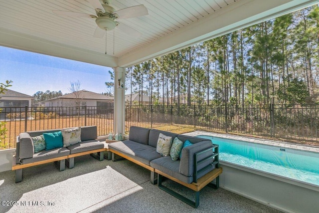 view of patio / terrace featuring a fenced in pool, outdoor lounge area, and ceiling fan