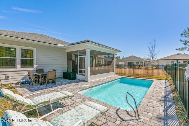 view of pool with a patio and a sunroom