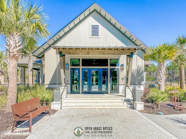 view of exterior entry featuring french doors