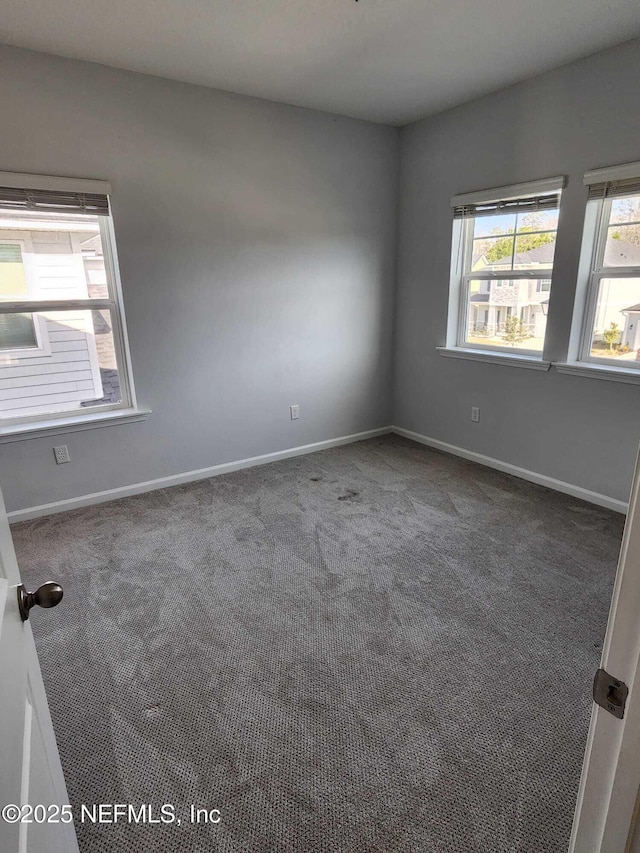 empty room featuring carpet flooring