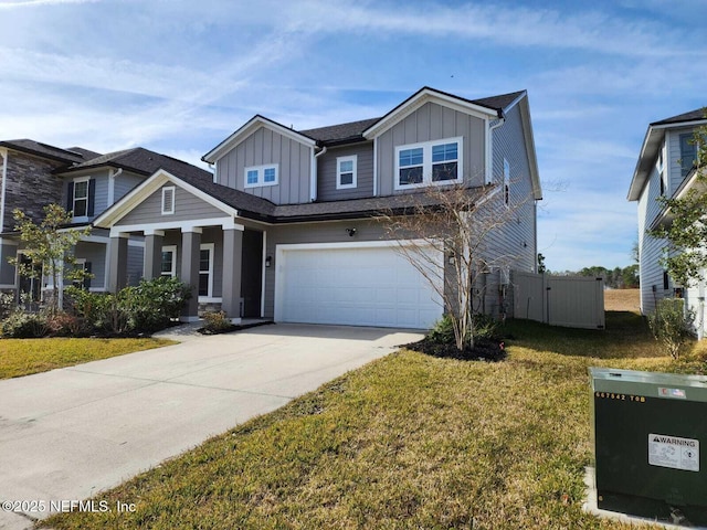 craftsman-style home featuring a garage and a front lawn