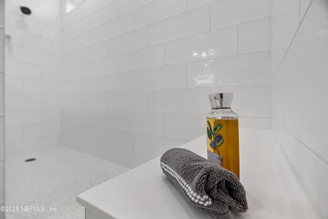 bathroom featuring tiled shower