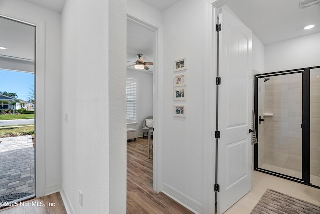 hall featuring light hardwood / wood-style floors