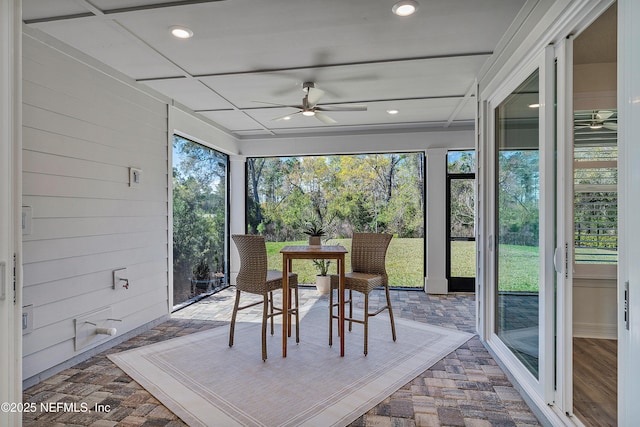 sunroom / solarium with ceiling fan