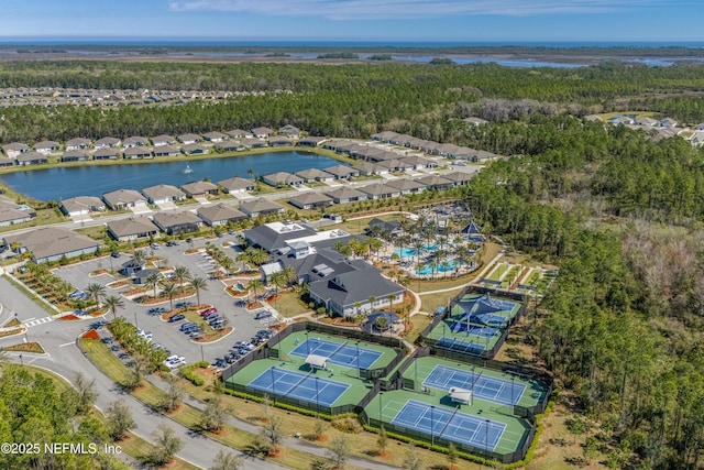 birds eye view of property with a water view