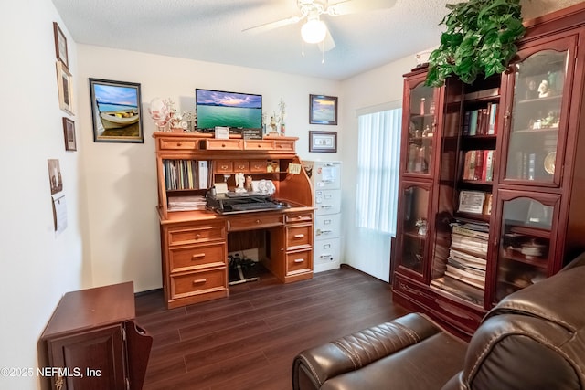 office area with dark hardwood / wood-style floors, a textured ceiling, and ceiling fan