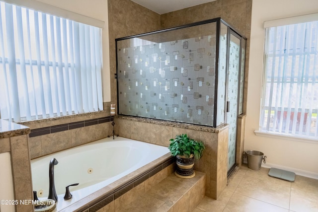 bathroom featuring plus walk in shower and tile patterned floors