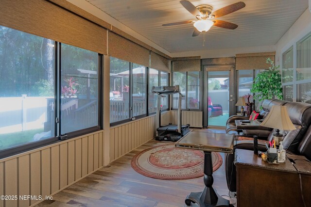 sunroom / solarium with ceiling fan