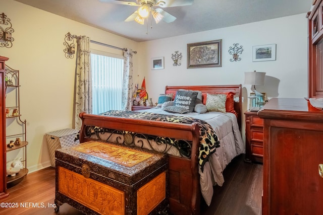 bedroom with dark hardwood / wood-style floors and ceiling fan