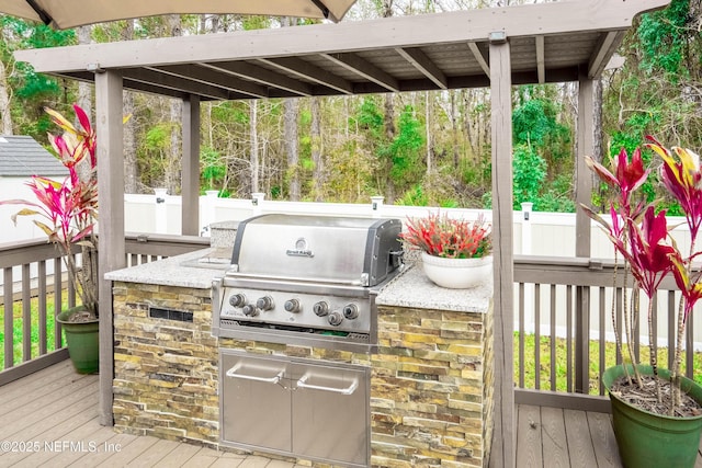 deck featuring an outdoor kitchen and grilling area