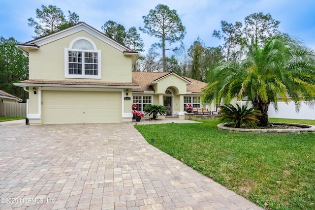 view of front of home featuring a garage and a front yard