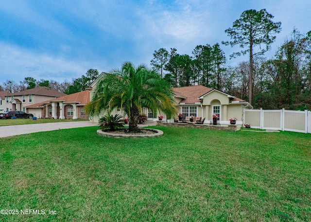 ranch-style home with a front yard