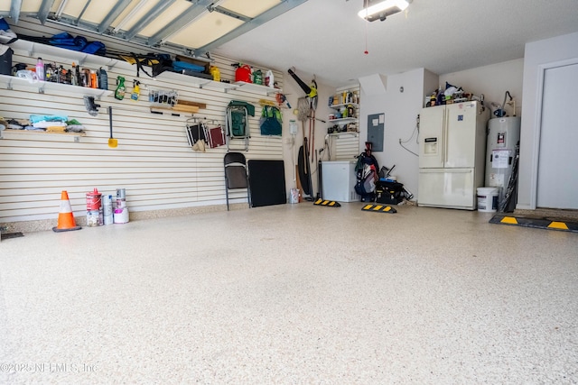 garage with a garage door opener, white refrigerator with ice dispenser, electric panel, and water heater