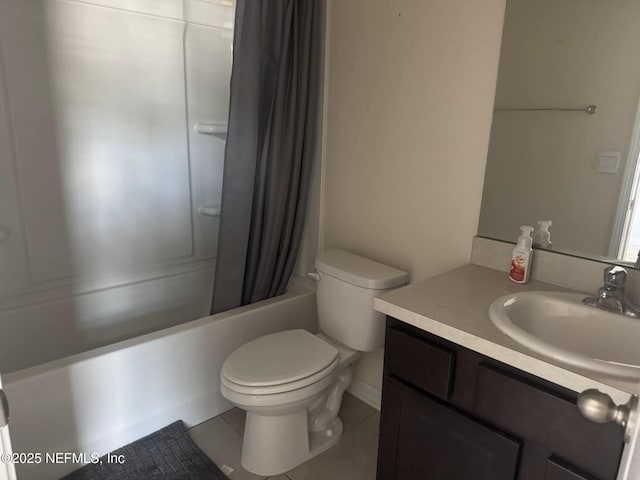 full bathroom with shower / bath combo with shower curtain, tile patterned floors, toilet, and vanity