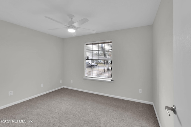 spare room with carpet floors and ceiling fan