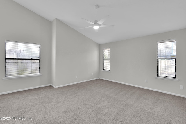 carpeted empty room featuring high vaulted ceiling and ceiling fan