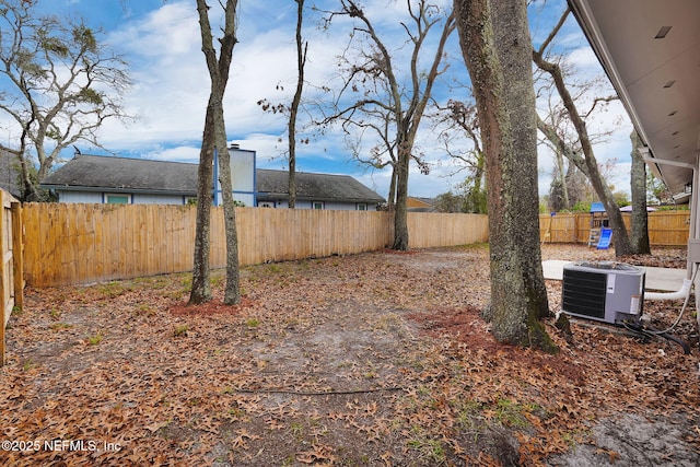 view of yard featuring central AC