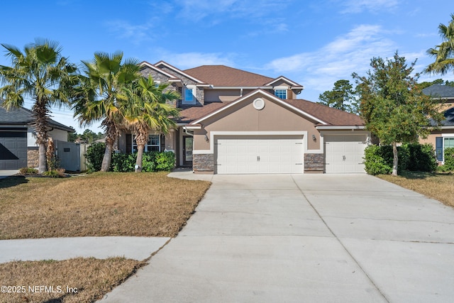 view of front facade with a garage and a front lawn