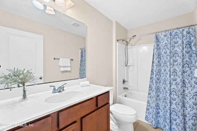 bathroom with vanity, tile patterned floors, a textured ceiling, and toilet