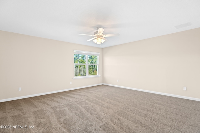 carpeted empty room with ceiling fan