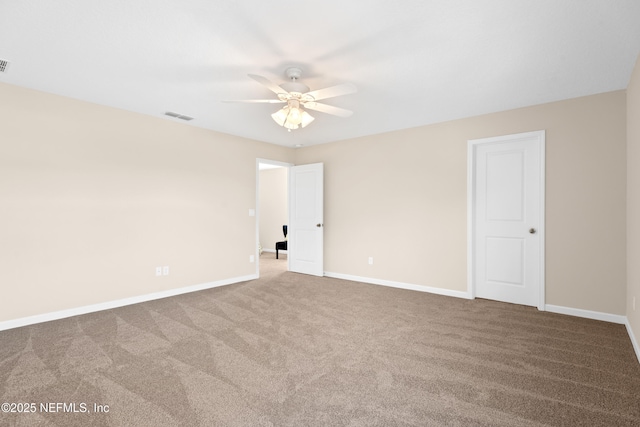 unfurnished room with carpet flooring and ceiling fan