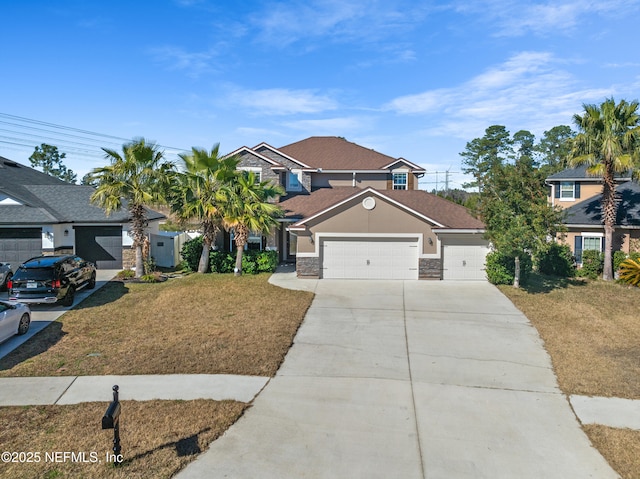 view of front of house featuring a garage and a front yard