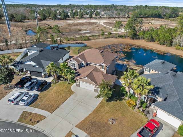 birds eye view of property with a water view