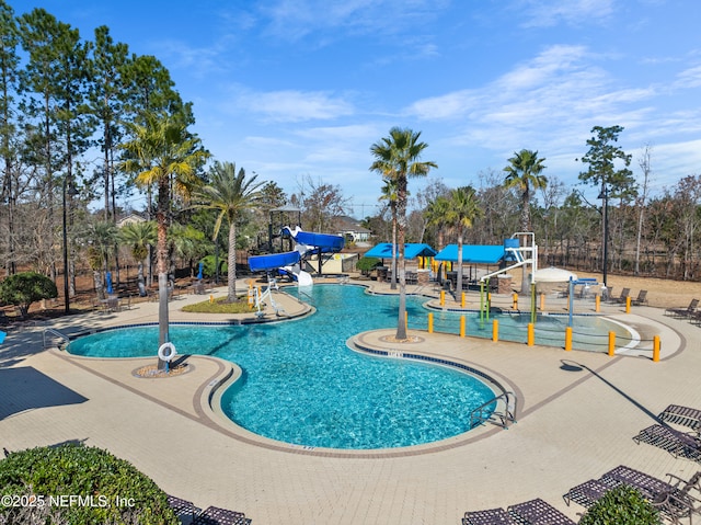 view of pool with a water slide