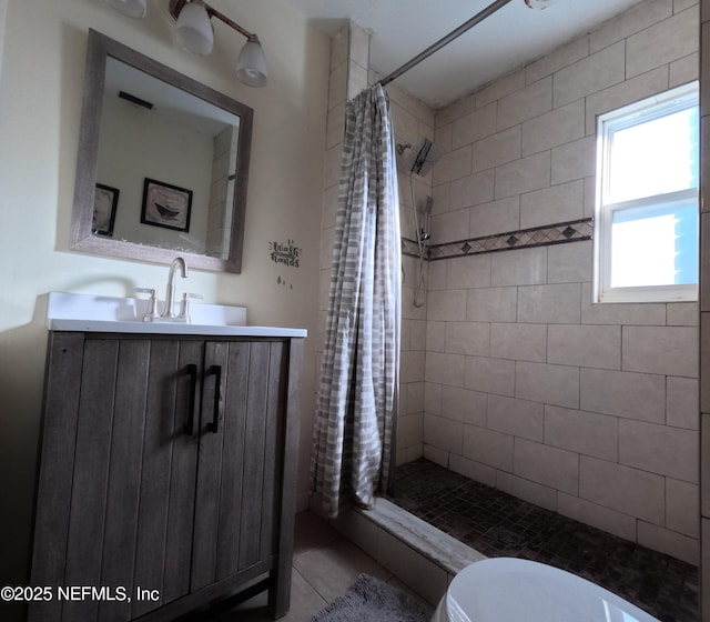 bathroom featuring walk in shower, vanity, and toilet