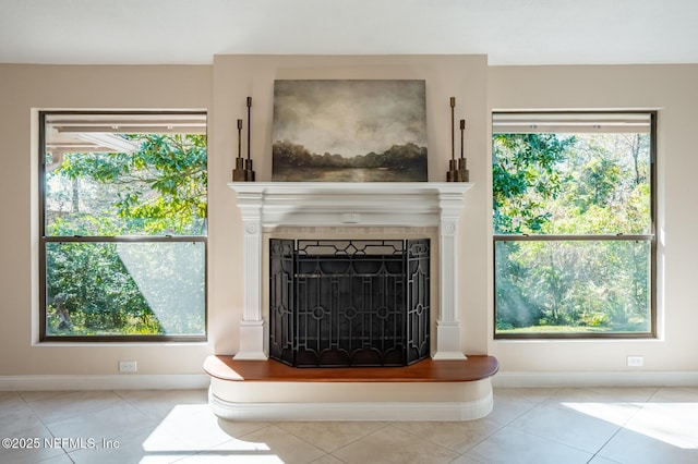 unfurnished living room with light tile patterned floors