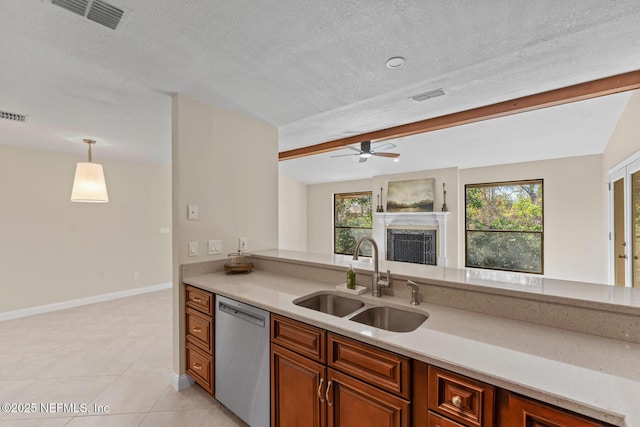 kitchen with plenty of natural light, dishwasher, sink, and hanging light fixtures