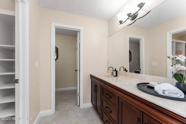 bathroom with vanity and tile patterned flooring