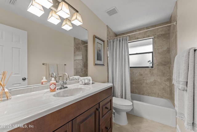 full bathroom featuring tile patterned floors, vanity, toilet, and shower / bath combo