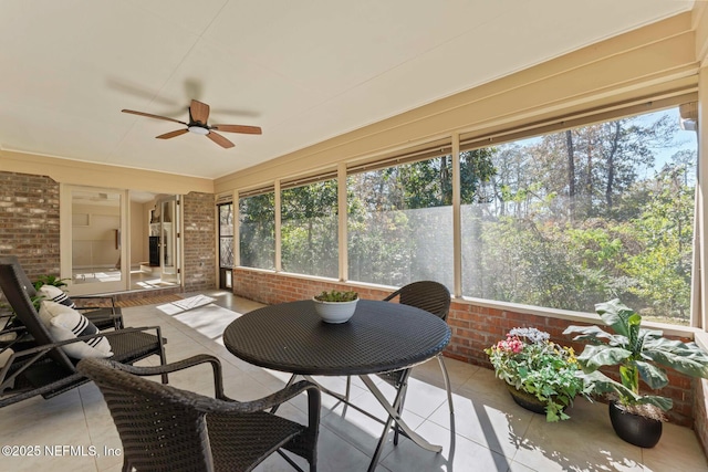 sunroom / solarium with ceiling fan