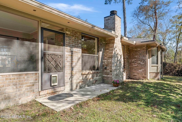 doorway to property featuring a yard