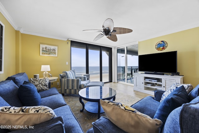 living room featuring hardwood / wood-style floors, crown molding, floor to ceiling windows, and ceiling fan