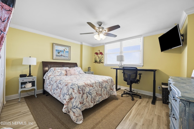 bedroom featuring ornamental molding, ceiling fan, and light wood-type flooring