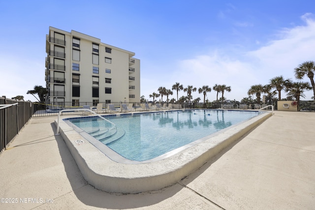 view of swimming pool featuring a patio