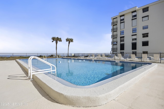 view of swimming pool featuring a patio