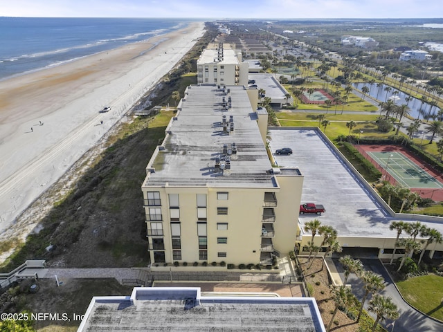 aerial view with a view of the beach and a water view